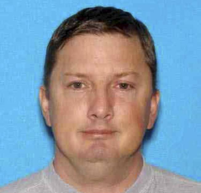This undated Oregon driver identification photo released Monday, July 27, 2015, by the Charleston, W. Va., Police Department shows Neal Falls, of Springfield, Ore., killed by a women he attacked on July 18 in Charleston. Police are investigating whether Falls had any connection to cases of suspicious deaths and missing women in other states, including Nevada.