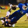 Photo: Green Valley QB Aj Amelburu (12) dives for a few m Photo: Green Valley QB Aj Amelburu (12) dives for a few m