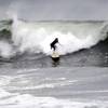 Photo: A surfer rides a wave at Ocean Beach, Tuesday, Oct Photo: A surfer rides a wave at Ocean Beach, Tuesday, Oct