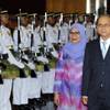 Photo: Myanmar's President Thein Sein, right, walks as he Photo: Myanmar's President Thein Sein, right, walks as he
