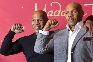 Former heavyweight boxing champion Mike Tyson, left, stands with the world’s first Mike Tyson wax figure during the figure’s unveiling Tuesday, Dec. 1, 2015, at Madame Tussauds Las Vegas. The figure is modeled after Tyson’s appearance as himself in “The Hangover.” The figure will be permanently displayed inside the attraction’s “The Hangover Experience” exhibit.