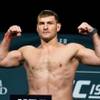 Photo: Heavyweight Stipe Miocic flexes on the scale durin Photo: Heavyweight Stipe Miocic flexes on the scale durin