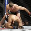 Photo: Stipe Miocic, top, fights Andrei Arlovski in a hea Photo: Stipe Miocic, top, fights Andrei Arlovski in a hea