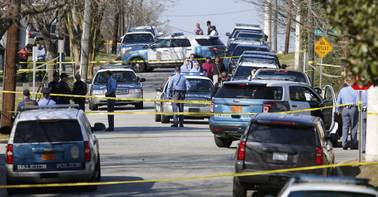 Raleigh police officers investigate the scene of an officer-involved shooting near Bragg and East Streets in east Raleigh, N.C., on Monday, Feb. 29, 2016. The Raleigh Police Department said in a statement that the shooting happened shortly after noon Monday, but provided no details on what led to the shooting, who was shot, or what that person’s condition was.
