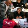Photo: An applicant smiles during a citizenship drive wor Photo: An applicant smiles during a citizenship drive wor