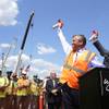 Wynn Boston Harbor President Robert DeSalvio, left, and Everett Mayor Carlo DeMaria, right, sound horns to signal an official start of construction as workers look on, left, at the site of the Wynn Boston Harbor resort casino complex, Thursday, Aug. 4, 2016, in Everett, Mass. Wynn Resorts is starting construction on its $2 billion Boston-area casino after years of legal fights. Wynn Boston Harbor President Robert DeSalvio, left, and Everett Mayor Carlo DeMaria, right, sound horns to signal an official start of construction as workers look on, left, at the site of the Wynn Boston Harbor resort casino complex, Thursday, Aug. 4, 2016, in Everett, Mass. Wynn Resorts is starting construction on its $2 billion Boston-area casino after years of legal fights.
