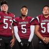 Photo: Members of the Desert Oasis High football team pos Photo: Members of the Desert Oasis High football team pos