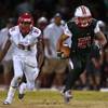 Photo: Liberty's Darion Acohido (21) breaks free from Arb Photo: Liberty's Darion Acohido (21) breaks free from Arb