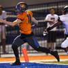 Photo: Bishop Gorman QB Tate Martell (18) scampers into t Photo: Bishop Gorman QB Tate Martell (18) scampers into t