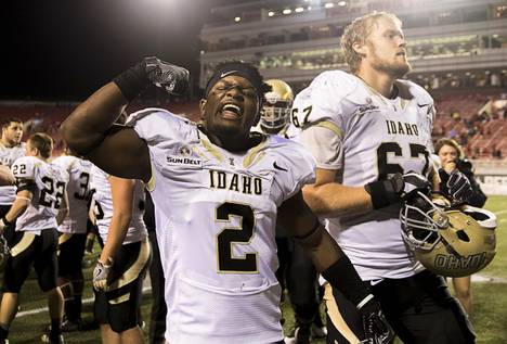 Idaho cornerback, D.J. Hampton, flexes in celebration after the Vandals upset UNLV in overtime.
