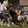 Fresno State QB Chason Virgil (5) is ls sacked by UNLV's Mike Hughes Jr. (99) at Sam Boyd Stadium in Las Vegas on Saturday, Oct. 1, 2016. Fresno State QB Chason Virgil (5) is ls sacked by UNLV's Mike Hughes Jr. (99) at Sam Boyd Stadium in Las Vegas on Saturday, Oct. 1, 2016.