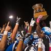 Photo: Basic players hoist the trophy and celebrate their Photo: Basic players hoist the trophy and celebrate their