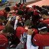 Photo: Liberty players come together in prayer on the sid Photo: Liberty players come together in prayer on the sid
