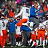 Photo: Bishop Gorman QB Tate Martell (18) leaps into the Photo: Bishop Gorman QB Tate Martell (18) leaps into the