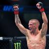 Photo: Bantamweight TJ Dillashaw begins to celebrate his Photo: Bantamweight TJ Dillashaw begins to celebrate his