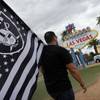 Matt Gutierrez carries a Raiders flag by the sign welcoming visitors to Las Vegas, Monday, March 27, 2017. NFL team owners approved the move of the Raiders to Las Vegas in a vote at an NFL football annual meeting in Phoenix. Matt Gutierrez carries a Raiders flag by the sign welcoming visitors to Las Vegas, Monday, March 27, 2017. NFL team owners approved the move of the Raiders to Las Vegas in a vote at an NFL football annual meeting in Phoenix.