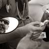Photo: A man is given as many new syringes as he can carr Photo: A man is given as many new syringes as he can carr