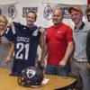 Prospective player Blake Johnson holds up a jersey joined by his family and Spring Valley High football head coach Marcus Teal as the program hosts a signing day event for incoming freshmen with hopes of drumming up interest to play on Tuesday, May 30, 2017. Prospective player Blake Johnson holds up a jersey joined by his family and Spring Valley High football head coach Marcus Teal as the program hosts a signing day event for incoming freshmen with hopes of drumming up interest to play on Tuesday, May 30, 2017.