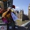 Photo: Flowers are seen at Westminster bridge to remember Photo: Flowers are seen at Westminster bridge to remember
