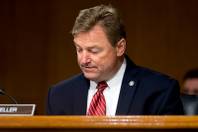 Sen. Dean Heller arrives as Federal Reserve Chair Janet Yellen testifies in front of the Senate Banking Committee in Washington, Tuesday, Feb. 14, 2017.