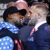 Photo: Boxer Floyd Mayweather Jr., left, and mixed martia Photo: Boxer Floyd Mayweather Jr., left, and mixed martia