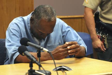 Former NFL football star O.J. Simpson reacts after learning he was granted parole at Lovelock Correctional Center in Lovelock, Nev., on Thursday, July 20, 2017. Simpson was convicted in 2008 of enlisting some men he barely knew, including two who had guns, to retrieve from two sports collectibles sellers some items that Simpson said were stolen from him a decade earlier.