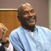 Photo: Former NFL football star O.J. Simpson laughs as he Photo: Former NFL football star O.J. Simpson laughs as he