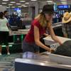 Photo: Travelers use new automated screening lanes at the Photo: Travelers use new automated screening lanes at the