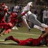 Photo: Arbor View's JJ Tuinei (35) upends Desert Pines' J Photo: Arbor View's JJ Tuinei (35) upends Desert Pines' J