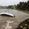 Photo: A boat lays on its side off the shore of Sainte-An Photo: A boat lays on its side off the shore of Sainte-An