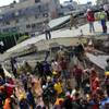 Photo: Rescue workers search for children trapped inside Photo: Rescue workers search for children trapped inside