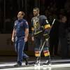 Photo: A first responder walks out onto the ice with Vega Photo: A first responder walks out onto the ice with Vega