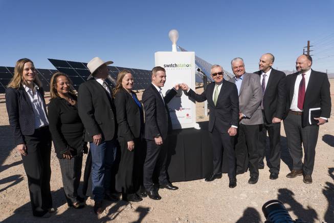 From left: Kathryn Arbeit, VP of Project Development Americas, First Solar, unknown, John Ruhs, Nevada State Director, Bureau of Land Management, Angela Dykema, Nevada Office of Energy, Cliff Graham, VP of Development U.S., EDF Renewable Energy, former U.S. Senator Harry Reid, Steve Sisolak, Chairman, Clark County Commission, Sam Castor, Executive Vice President of Policy - Switch, Dave Ulozas, Senior VP of Renewable Resources, NV Energy pose for a photo during the honorary flipping of the switch to celebrate the commissioning of the 179 megawatt Switch Station 1 and 2 Solar Projects, Monday, Dec. 11, 2017. This is the first-ever project to be built in one of the Bureau of Land Management's Solar Energy Zones.