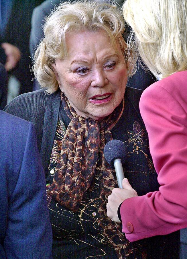 In this April 1, 2002, file photo, actress and comedian Rose Marie talks to the press as she arrives for a ceremony honoring comedian Milton Berle at Hillside Memorial Park and Mortuary in Los Angeles. Family spokesman Harlan Boll said Marie, the wisecracking Sally Rogers of “The Dick Van Dyke Show,” died Thursday, Dec. 28, 2017. She was 94.