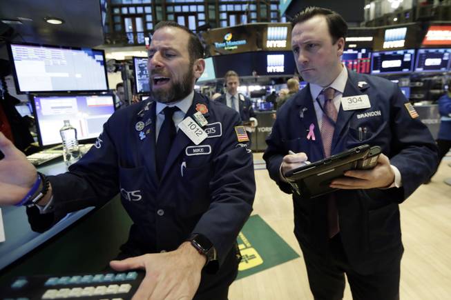 U.S. stocks swing wildly as Wall Street volatility persists, global stocks drop