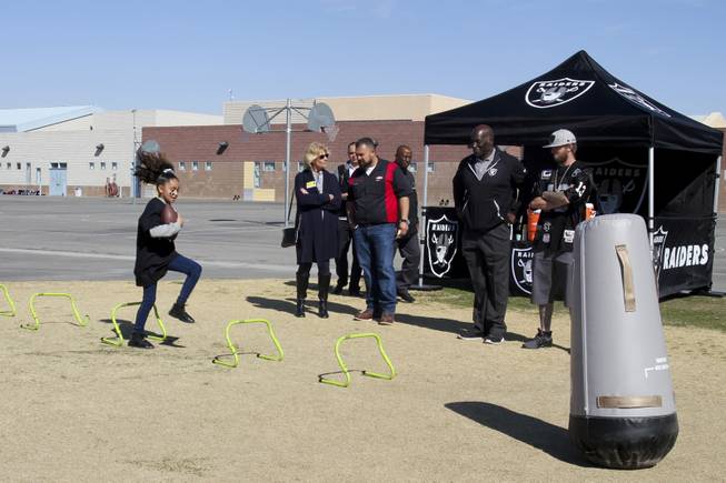 The Raiders, including Raider alumni Reggie Kinlaw and their mascot Raider Rusher, and the Nevada Dairy Council gave Sandy Searles Miller Academy a $10,000 Hometown Grant award in conjunction with the Fuel up to Play 60 campaign, which encourages kids to be active an hour a day, Wednesday, February 28, 2018. MICK ACKERS