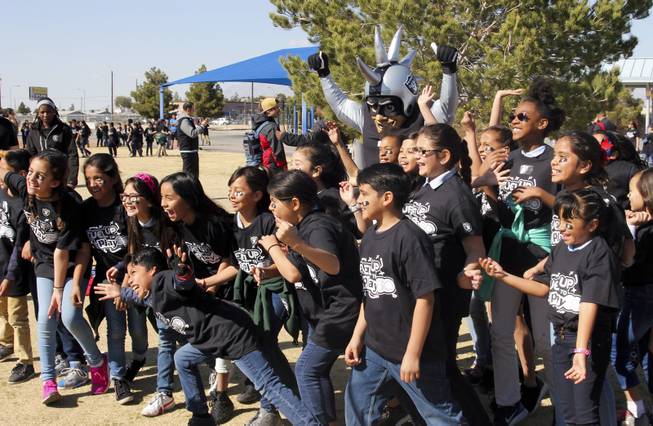 The Raiders, including Raider alumni Reggie Kinlaw and their mascot Raider Rusher, and the Nevada Dairy Council gave Sandy Searles Miller Academy a $10,000 Hometown Grant award in conjunction with the Fuel up to Play 60 campaign, which encourages kids to be active an hour a day, Wednesday, February 28, 2018. MICK ACKERS
