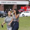 Photo: A student is comforted by a school official as stu Photo: A student is comforted by a school official as stu