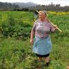 Photo: Dolores Leis stands in a field on her farm in Gali Photo: Dolores Leis stands in a field on her farm in Gali