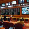 Photo: In this May 14, 2018, file photo, people make bets Photo: In this May 14, 2018, file photo, people make bets