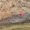 Photo: An airplane dumps fire retardant on a wildfire at Photo: An airplane dumps fire retardant on a wildfire at
