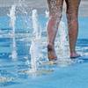 Photo: Taylor Jeremiah cools off while walking through a Photo: Taylor Jeremiah cools off while walking through a