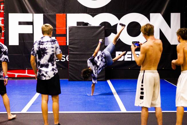 Influencers look on as a fellow influencer flips on the trampoline floor during the second annual FlipCon event sponsored by Circus Trix at their park Gravady in Las Vegas, Monday, 23, 2018. FlipCon invites influencers from all over the U.S. to participate in SuperTramp activities to produce content for their fan base and to network with fellow influencers.