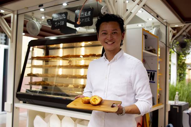 Tony Chong serves up Portuguese Egg Tarts at his Pastel De Nata 1881 stand at the North Premium Outletss.