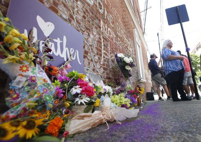 ChSusan Bro, mother of Heather Heyer who was killed during last year's Unite the Right rally, speaks with reporters at the spot where her daughter was killed in Charlottesville, Va., Friday, Aug. 10, 2018. The governor has declared a state of emergency in anticipation of the anniversary of the rally.