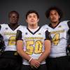 Photo: Members of the Clark High football team pose for a Photo: Members of the Clark High football team pose for a
