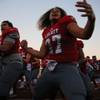 Photo: Liberty High's Jared Tufele (27) performs a haka d Photo: Liberty High's Jared Tufele (27) performs a haka d