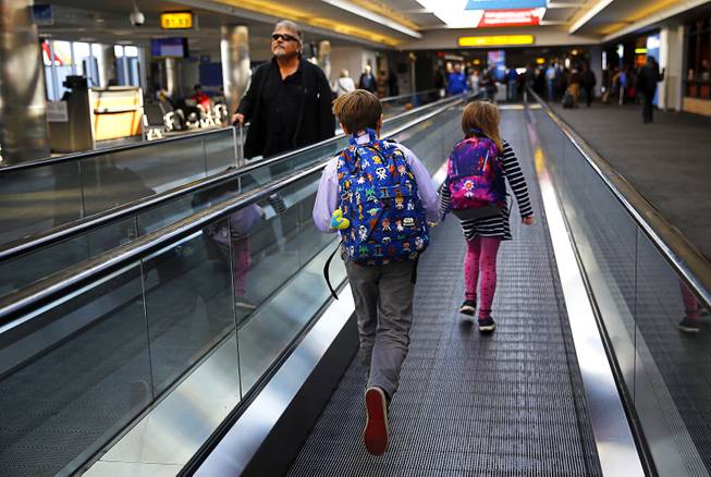 Busy roads, some airport delays as holiday travel gets underway