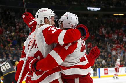 Detroit Red Wings right wing Anthony Mantha (39) celebrates with teammate Dylan Larkin (71) after scoring in overtime for a 3-2 win over the Vegas Golden Knights at T-Mobile Arena Saturday, March 23, 2019.