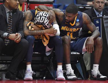 Murray State's Ja Morant, left is consoled by teammate Murray State's Shaq Buchanan, right, during the second half of a second round men's college basketball game against Florida State in the NCAA tournament, Saturday, March 23, 2019, in Hartford, Conn.